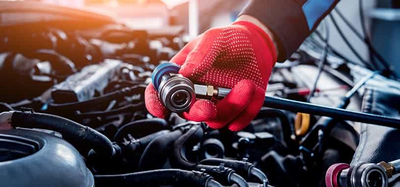 repairman fixing aircon regas