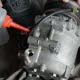 auto mechanic checking car air conditioner