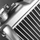 A close-up of the cap on a car radiator.