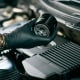 mechaninc changing an engine oil filter
