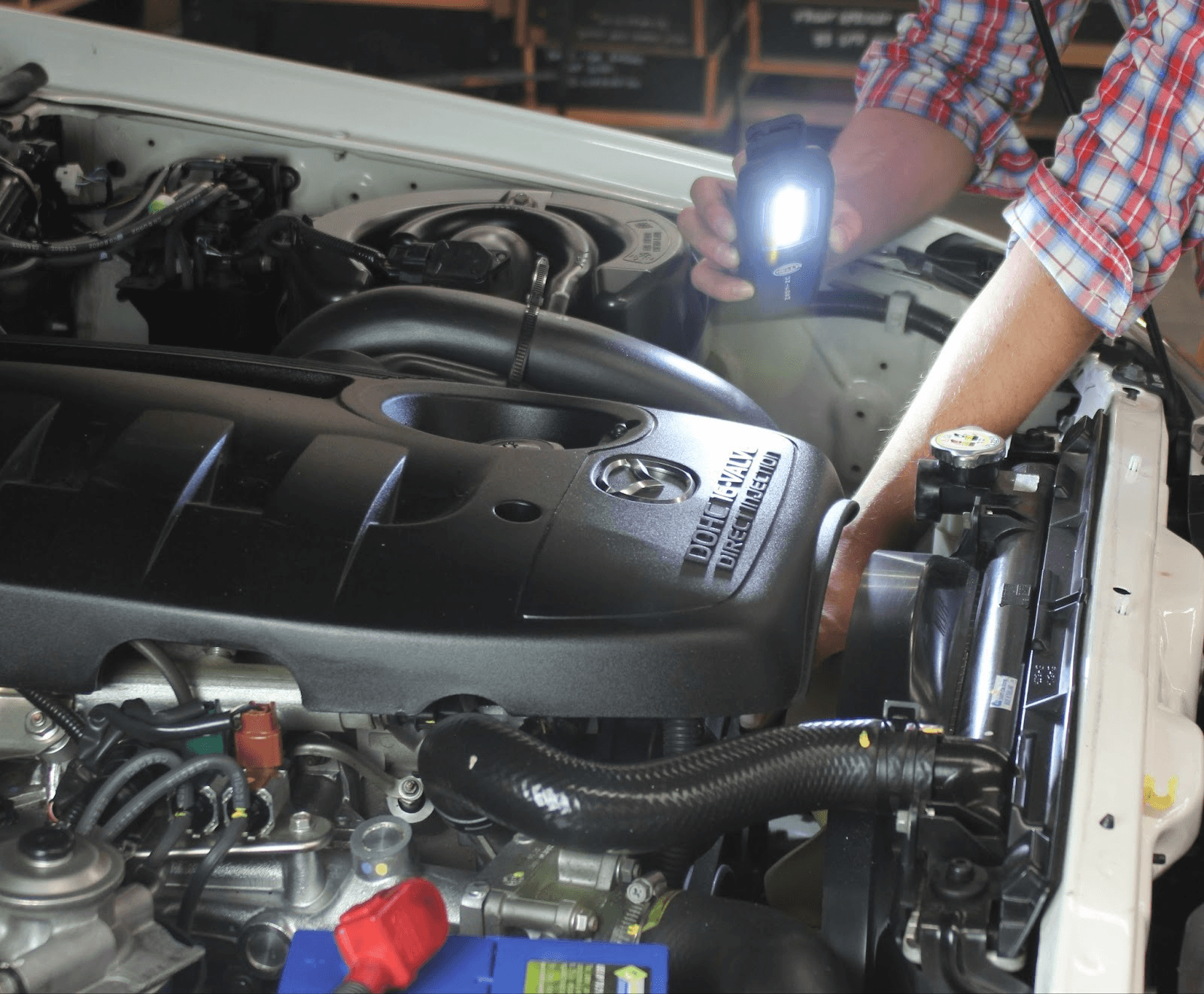 Close up of engine bay cooling system inspection